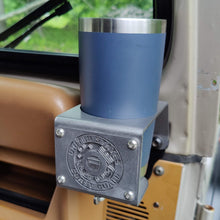 Cargar imagen en el visor de la galería, Metal cup holder with USCG logo mounted to dash of Jeep Wrangler YJ