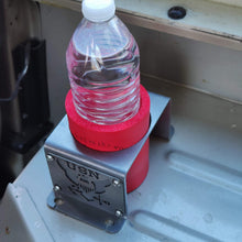 Load image into Gallery viewer, Metal cup holder with USN logo in rear of Jeep Wrangler YJ
