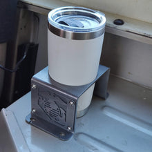 Load image into Gallery viewer, Metal cup holder with USMC logo in rear of Jeep Wrangler YJ