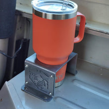 Load image into Gallery viewer, Metal cup holder with USMC logo in rear of Jeep Wrangler YJ