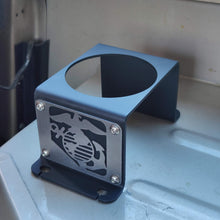 Load image into Gallery viewer, Metal cup holder with USMC logo in rear of Jeep Wrangler YJ