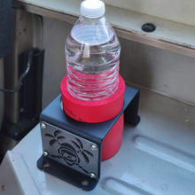Load image into Gallery viewer, Metal cup holder mounted in rear of Jeep YJ