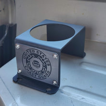 Load image into Gallery viewer, Steel cup holder with US Coast Guard logo in rear of Jeep Wrangler YJ
