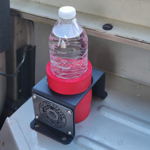 Load image into Gallery viewer, Steel cup holder with US Coast Guard logo in rear of Jeep Wrangler YJ
