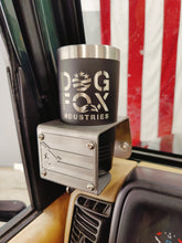 Cargar imagen en el visor de la galería, A steel cup holder with a mounting bracket, featuring the text 'Dog Fox Industries' and a Puerto Rican flag-themed design, attached to a Jeep Wrangler TJ