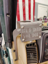 Cargar imagen en el visor de la galería, Metal made in the USA cup holder with "But Did You Die?" logo installed in Jeep TJ