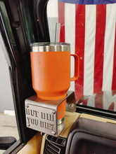 Cargar imagen en el visor de la galería, Metal made in the USA cup holder with "But Did You Die?" logo installed in Jeep TJ