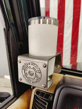 Cargar imagen en el visor de la galería, White travel coffee mug inside metal cup holder that has USCG logo mounted on drivers side of TJ Jeep Wrangler