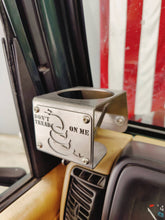 Carica l'immagine nel visualizzatore di Gallery, Metal made in the USA cup holder with "Don't Tread On Me" logo installed in TJ Jeep