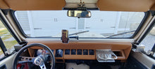 Load image into Gallery viewer, Secure, multi-purpose dash mount for phones and accessories in a Jeep YJ