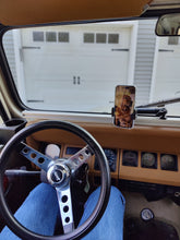 Load image into Gallery viewer, A convenient dash mount for holding phones and accessories in a Jeep YJ